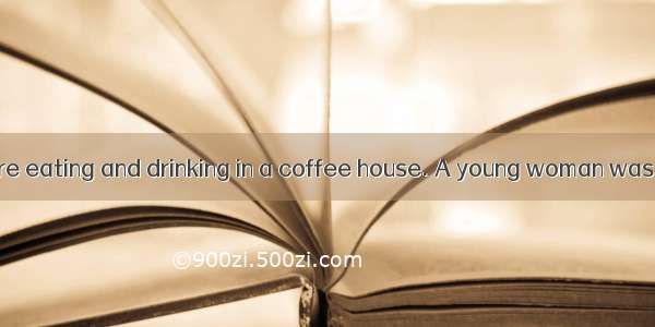 Some people were eating and drinking in a coffee house. A young woman was sitting alone at